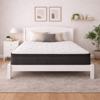 White bed with black mattress in a bedroom setting